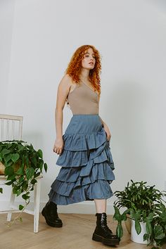 Ready to ship. Eco Denim Our beautiful palace midi skirt features ruffles that cascade down creating a very romantic, yet slimming fit. Beautifully made, with the perfect fit at the waist. Eco denim is dyed with eco friendly practices in India. Hand wash or eco wash recommended. As this denim has not been treated with a sealer we recommend that you pre-wash it at home, we did this to protect the environment. All of our collection garments have been produced ethically with eco consciousness in mi Spring Denim Blue Asymmetrical Skirt, Denim Blue Tiered Cotton Skirt, Spring Asymmetrical Dark Wash Skirt, Spring Dark Wash Asymmetrical Skirt, Medium Wash Asymmetrical Skirt For Spring, Spring Ruffled Tiered Denim Skirt, Spring Medium Wash Asymmetrical Skirt, Spring Tiered Ruffled Denim Skirt, Spring Ruffled Medium Wash Denim Skirt