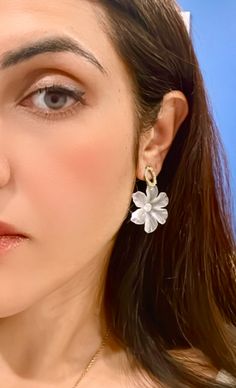 The Floral acrylic earrings are not only beautiful but also versatile, suitable for both casual and formal occasions. They are lightweight and comfortable to wear, making them a perfect accessory for any outfit. These gorgeous white earrings are the perfect gift for anyone who appreciates natural beauty and unique jewelry. Free Estimated Delivery: 3-4 Days Delivery Trendy Flower Earrings For Gift, Trendy Earrings For Spring, Elegant White Flower Hoop Earrings, Trendy Drop Flower Earrings, Chic Dangle Flower Earrings For Pierced Ears, Chic Dangle Flower Earrings, Trendy White Drop Pearl Earrings, Trendy White Pearl Drop Earrings, Trendy Single White Earring