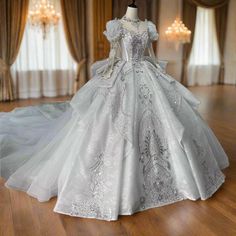 a white wedding dress on display in a room