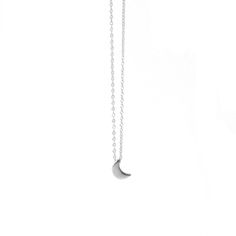 Half moon-shaped charm necklace. This delicate necklace is perfect for wearing alone or for layering with other necklaces. Everyday necklace perfect for any occasion. Details: * Crafted in Gold vermeil plated .925 sterling silver * Also available in 925 silver * Necklace measures 18inch in total. * Comes with an extension chain and can be worn at 16inch or 18inch. * Nickel free Moon charm measures: 10x6mm All jewelry comes in beautiful packaging, gift ready. Made with love Feel free to contact m Everyday Crescent Necklace With Delicate Chain, Minimalist Crescent Charm Necklace With Clavicle Chain, Minimalist Moon Phase Pendant Necklace, Minimalist Crescent Clavicle Chain Charm Necklace, Minimalist Crescent Necklaces For Everyday, Everyday Moon Shaped Necklace With Delicate Chain, Minimalist Half Moon Necklace With Adjustable Chain, Silver Chain Necklace With Moon Charm As Gift, Minimalist Half Moon Clavicle Chain Necklace