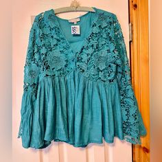 Brand New! Never Worn. Lined. Cotton. Bell Sleeve. Lace. Comes From A Clean, Smoke Free Home. Bohemian V-neck Lace Top For Day Out, Chic Turquoise Spring Tops, Chic Turquoise Blouse For Spring, Bohemian V-neck Crochet Top For Brunch, Spring Bohemian Long Sleeve Lace Top, Bohemian Long Sleeve Crochet Top For Spring, Bohemian Crochet Top With Long Sleeves For Day Out, Blue Flowy Peasant Top For Spring, Bohemian Blouse With Lace Top For Day Out