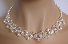 "Stunning Pearl and Crystal Necklace!  This gorgeous pearl and crystal choker necklace is made with white pearls and bicone crystals in AB finish. Aurora Borealis is a rainbow like coating that adds sparkle and all the colors from crystal through ping, gold even blue! It has all the sparkle you need for your special day! The perfect accessory for any bride or bridesmaid. Necklace details: - made with white pearls and AB crystals - measures 19.68\" (50cm) long, - finished with a Sterling Silver Lobster clasp and 1,5\" extension for an adjustable fit.  If You need any larger size, please let me know. This necklace will come in a pretty gift box - ready for gift giving. No extra charge for it. I do my best to photograph and describe my jewelry as accurately as possible, but please bare in min Swarovski Choker, Beaded Crystal Necklace, Swarovski Pearl Necklace, Pretty Jewelry Necklaces, Pearl Necklace Wedding, Necklace Swarovski, Crystal Choker Necklace, Necklace For Girlfriend, Swarovski Necklace