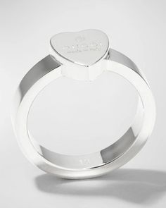 Gucci ring with engraved heart..Sterling silver..1/8' band width; 1/4' setting width; 3/8' setting height.Polished sterling silver hardware..Clean and polish with a soft cloth, store separately..Made in Italy..Engraved with the Gucci name and trademark symbol. This piece has been produced using hypoallergenic materials in accordance with the current international regulations Classic Gucci Engraved White Gold Ring, Classic Gucci Engraved Ring For Anniversary, Classic Gucci Engraved Ring As Gift, Classic Gucci Engraved Ring For Gift, Gucci Luxury Silver Rings, Gucci Sterling Silver Ring, Luxury Silver Gucci Rings, Gucci Silver Ring With Polished Finish, Gucci Rings For Anniversary