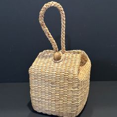 Handcrafted Woven Bag With Loop Handle Straw Bag, Hyacinth Basket, Unique Purse New This Handcrafted Bag Is A Unique Piece Of Artisanship. The Woven Pattern And Straw Exterior Make It A Standout Accessory For Any Woman's Wardrobe. The Loop Handle And Medium Size Provide Practicality While Maintaining A Stylish Look. The Lining Material Add To The Overall Cohesive Design Of The Bag. This Satchel/Top Handle Bag Is Perfect For Any Occasion, Whether It Be A Casual Outing Or A Special Event. Add This Rectangular Natural Bucket Bag For Market, Natural Bucket Box Bag For Everyday Use, Rectangular Bag With Bamboo Handle As Gift, Natural Square Bucket Bag For Daily Use, Handmade Square Natural Bucket Bag, Square Natural Color Bucket Bag For Daily Use, Natural Rectangular Bucket Bag For Market, Rectangular Bags With Bamboo Handle For Gift, Rectangular Bucket Bag With Braided Handles