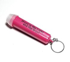 a pink keychain with a message on it that says jesus is the flesh and the way