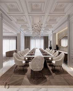 a long dining table with chairs and chandelier hanging from the ceiling in an elegantly decorated room