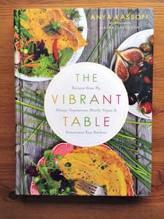 the vibrant table cookbook on a wooden surface