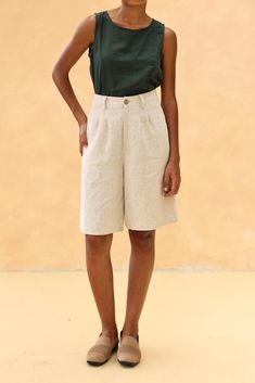 The linen loose-fitted knee-length shorts offer a comfortable and casual fit, perfect for warm days. Handcrafted in our studio to your measurements and preferences, available in over 60 colors. DETAILS - 100 % linen, medium weight (200gsm), free-shrinkage, amazingly soft feel - Knee-length shorts; different length is possible - Loose fit - High waisted - Pleated front - Front button and zipper - Inseam pockets - Custom made pants, FREE customizations; simply let us know your needs (hem length, fit style, leg opening width, belt, etc.). - Handcrafted in our studio, French seams, clean and meticulous COLOR - The color shown is Beige. - Available in over 60 colors, choose color in the color chart in the listing. - Link of fabric samples available here: https://madebygaiavn.etsy.com/listing/13 Linen Shorts Women, Shorts Linen, Pocket Shorts, Knee Length Shorts, Womens Trousers, French Seam, Womens Pants, Shorts Women, Long Shorts