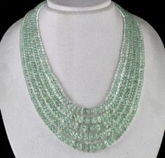 PRODUCT DETAILS LINE 5/CTS 939 GREEN AMETHYST FACETED BEADS SIZES OF THE BEADS IS 10MM TO 5MM INNER LENGTH OF THE NECKLACE IS 17 INCHES OUTER LENGTH OF THE NECKLACE IS 20 INCHES GREEN AMETHYST ATTACHED TO SPECIAL SIZABLE SILK CORD BUY IT NOW... NOTE - #You will receive the same product you see in picture. #DEAR ETSY BUYERS PLEASE FEEL FREE TO ASK QUESTIONS #WE WILL BE GLAD TO ANSWER & SOLVE QUERY REGARDING THIS PRODUCTS #RETURN POLICY Every piece of jewellery and inputs (gem stones, diamonds Round Bead Necklace, Silk Cord, Green Necklace, Green Amethyst, Gem Stones, Rock Crystal, Faceted Bead, Necklace Designs, Gemstone Necklace