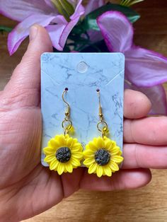 💫Come visit my shop!💫    --Cosmic CrysDals--        https://cosmiccrysdals.etsy.com Whimsical Sunflower 🌻 Earrings  Sunflower resin charm with yellow glass accent bead on gold rings -925 silver plated gold wires