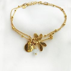 "The subtle Dainty layering dragonfly  bracelet is truly beautiful-  intricately detailed  so sweet jewelry. May be worn on its own, or styled with the other. This is \"double face\" charm-same for both side , no worry on the pendant twist ! Matching jewelry available :)  https://www.etsy.com/shop/AnemonAtelier?ref=seller-platform-mcnav&search_query=dragonfly ♡ DETAILS  Pendant : 0.66\" x 0.78\" (17 mm x 2 cm) Material:  24 k gold plated over 925 sterling silver  Lenght: 6.29\" - 16 cm plus exte Delicate Adjustable Yellow Gold Charm Bracelet, Dainty Gold-tone Charm Bracelet Gift, Delicate Adjustable Gold Charm Bracelet, Delicate Gold Charm Bracelet, Delicate Gold-plated Charm Bracelet, Handmade Gold Dragonfly Jewelry, Adjustable Gold Dragonfly Jewelry, Elegant Adjustable Dragonfly Jewelry, Adjustable Gold Charm Bracelet With Delicate Chain