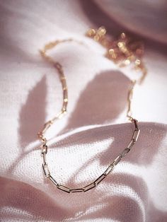 A dainty new classic, the Kala'i Paperclip Chain Necklace is a stunning addition to your collection. Made from 18kt Gold Filled, this popular paper clip style chain is versatile, elegant necklace is a striking statement worn alone or with a bevy of other beauties. ✦ DETAILS ✦ ✧ Name: Kei (KEH ee) - One's pride and glory. ✧ You will receive one necklace. ✧ Links measure 2mm x 5.5mm each. ✧ 18kt Gold Filled with a spring clasp. ✧ All Ke Aloha Jewelry pieces come packaged thoughtfully, beautifully, Minimalist Paperclip Chain Necklace As Gift, Minimalist Paperclip Chain Necklace For Gift, Minimalist Paperclip Chain Necklace Gift, Elegant Paperclip Chain Necklaces For Formal Occasions, 14k Gold Filled Chain Necklace Gift, Minimalist Paperclip Necklace As Gift, Minimalist Paperclip Necklace For Gift, Elegant Paperclip Chain Necklace For Formal Occasions, Classic Rose Gold Necklace With Gold Chain