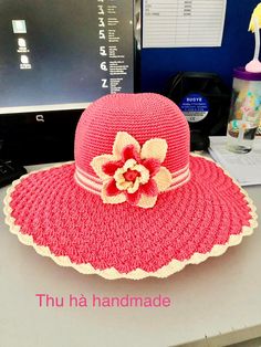 a pink hat sitting on top of a desk