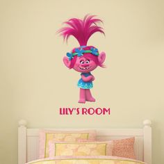 a wall decal with a pink troll holding a heart