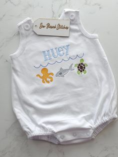 Personalized boy bubble  Our unisex bubble is perfect for the hot summer days and vacation to the beach!  Super soft with snaps at the bottom for easy diaper change and buttons at the shoulders.  Machine wash inside out. Tumble dry low.  Please leave clear instructions with name or initials, font and thread color.  By submitting your order, you agree that everything entered in the personalization box is correct, including name spelling. Due to the personalization, custom orders cannot be cancele Blue Summer Bubble Romper For The Beach, Blue Summer Bubble Romper For Beach, White Summer Bubble Romper For Beach, Playful White Diaper Cover For Summer, Fun Summer Beach Bubble Romper, Cute White Diaper Cover For Summer, Cute White Summer Diaper Cover, Cute Summer Beach Diaper Cover, White Cotton Diaper Cover For Summer