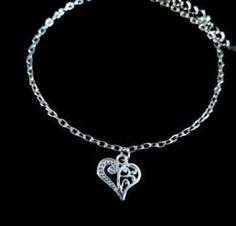 New Handmade Scroll Heart Anklet ~ Stainless steel anklet chain and charm will not tarnish ~ Scroll heart charm ~ Available in 8.5, 9.5 or 10.5 inch length ~ Includes a 2 inch extender ~ Hypoallergenic, Nickle free ~ Ships within 24 hours of purchase Monday-Saturday Gift Packaging & Messages: Your item will be lovingly packaged and labeled as a handmade item.  Item's that ship with gift boxes are stated in the description. Handwritten gift notes available, just include a gift message with your o Heart-shaped Metal Anklets As Gift, Heart-shaped Metal Anklets For Gift, Adjustable Heart Metal Anklets, Adjustable Heart-shaped Metal Anklet, Silver Adjustable Heart-shaped Anklets, Adjustable Silver Heart Anklets, Casual Silver Anklets As Gift, Casual Silver Anklets For Gifting, Casual Silver Anklets For Gifts