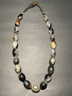 Beautiful/ interesting Antique Himalayan Oval-shaped Agate Beads Necklace from Himalaya(Tibet).Wearable & very unique agates necklace.The Centre piece agate stone has very unique sheep eyes (luk mik) in Tibetan.Beautiful nice patina and great shaped . Tibetan Agate has the meaning and properties of blocking evil energy around you. It is popular as an excellent amulet against evil. It helps maintain a peaceful everyday life. They are considered to be very powerful stones of protection and good luck. Measurements:- Beads size - 15mmx22mm                        20mm-27mm Neckace length - 24.5inches (approximately) Weight- 262 grams  ** Colors may vary slightly  in person due to the lighting/flash lighting in photo shoots. Oval Agate Gemstone Beaded Necklaces, Oval Agate Gemstone Bead Necklaces, Traditional Oval Necklaces With Polished Beads, Artisan Oval Gemstone Bead Necklaces, Artisan Oval Gemstone Beads Necklace, Oval Agate Necklace For Healing, Unique Oval Agate Necklaces, Oval Agate Beaded Necklaces, Unique Oval Agate Necklace