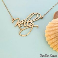 Order any name for your solid 14K gold Kelly Artistic style nameplate necklace!! A great personalized custom made gift for any occasion!! Birthday, Graduation or Any Holiday! *Both the nameplate and chain are all solid 14k gold. *Stamped for authenticity 14K (Hallmarked 14k) *Nameplate is 0.9 mm high quality thickness. *Font is larger than my other fonts, the capital will be approximately 1.3 cm tall *This listing is for one (1) name with one (1) capital letter only! Maximum is 9 letters. 10 or Silver 14k Gold Name Necklace For Anniversary, Customizable 14k Gold Name Necklace For Anniversary, Yellow Gold Name Necklace For Anniversary Gift, Customizable Yellow Gold Name Necklace For Anniversary, Personalized Gold Necklace For Anniversary, Personalized Gold Necklace For Anniversary Gift, Customizable Yellow Gold Necklace For Anniversary, 14k Gold Custom Name Necklace For Anniversary, Custom Name 14k Gold Necklace For Anniversary