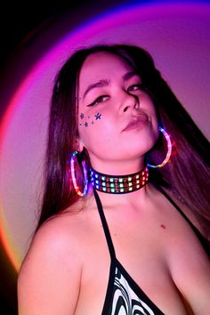 Expand your glow-filled wardrobe with the LED Choker Necklace. This colorful accessory features bright LED lights that respond to music, flashing and glittering to the beat of your favorite songs. Adjustable around your neck, this choker sits comfortably, and the battery pack fits comfortably on your back, so you hardly notice it's there. This quality-crafted sound-reactive LED Choker Necklace is a must for night concerts, festivals, and rave parties. It has bright, colorful lights that glitter Multicolor Rave Jewelry For Party, Trendy Neon Jewelry For Party, Rave Jewelry For Music Festival With Adjustable Fit, Black Glow In The Dark Jewelry For Parties, Black Glow In The Dark Party Jewelry, Rave Multicolor Choker For Festivals, Rave Style Multicolor Choker, Constellation Earrings, Colorful Lights