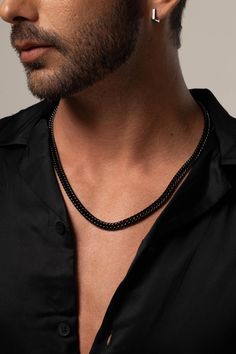 The 7.3mm Men's Black Cuban Chain Necklace is a bold and versatile accessory, crafted from durable stainless steel. This Cuban link necklace is not only stylish but also waterproof, making it perfect for everyday wear. Whether as a gift for your husband or a statement piece for any occasion, this necklace adds a touch of modern sophistication to his look. * Made to order * Materials: Stainless Steel * Color: Black Plating * Chain Width: 7.3mm Approximately * Chain Length: 24" Inches Approximatel Durable Black Stainless Steel Jewelry, Black Chain Link Jewelry For Everyday, Everyday Black Chain Link Jewelry, Everyday Black Link Chain Necklace, Everyday Black Box Chain Necklace, Classic Black Link Jewelry, Black Curb Chain Necklace For Everyday, Minimalist Black Chain Link Jewelry, Classic Black Chain Link Necklace