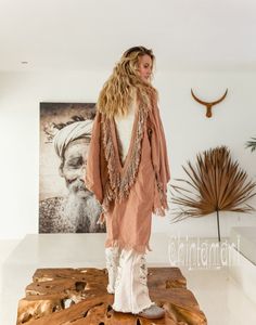 Alma Libra Linen Kimono Robe is a unique mix of boho, American Indian   and oriental elements into an alchemical Chintamani masterpiece. Made   out of soft pure linen, it comes in raw unbleached silver-grey color or   hand dyed delicate tints of pink, cream and strong, wholesome black.   From the front it reminds of classic Japanese kimonos with simple square   silhouette, but hey have long   slits on top, so that your hands show off completely Pink Wrap Kimono In Bohemian Style, Pink Bohemian Wrap Kimono, Bohemian Long Sleeve Kimono For Loungewear, Pink Kimono For Fall Vacation, Hippie Pink Kimono For Festival, Pink Hippie Kimono For Festival, Pink Bohemian V-neck Kimono, Pink Fall Vacation Kimono, Pink Bohemian Kimono For Loungewear