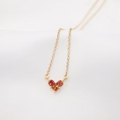 Dainty ruby heart shaped pendant necklace. Designed and handcrafted in our Burlington Studio. ------------------------------------------------------------- PRODUCTS DETAILS Pendant: 6X8mm Pendant: 14K gold plated cubic zirconia Chain and findings: 14K gold filled Total length (include pendant): 16"/18"/20"22" available from drop-down list, other length pls leave me a message for customization. Model: 16'' chain ------------------------------------------------------------- PACKAGE Gift packed: Je Ruby Heart, Heart Shaped Pendant Necklace, Heart Shaped Pendant, Heart Shaped Necklace, Ruby Pendant, Wedding Party Jewelry, Necklace Heart, Chain Design, Heart Shape Pendant