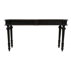 an antique console table with two drawers on one side and three legs, in black finish