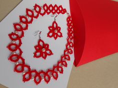 Necklace, earrings Tatted lace jewelry set red READY TO SHIP Gift wrapped New Particular, special, handmade jewelry for festive occasions Delicate lace made of pure cotton thread. Unique handmade tatted jewelry set , necklace with earrings made out of  red cotton thread with added  white beads. Many hours of handwork are woven into this beautiful jewelty My handcrafted made with a lot of love and skill acquired over the years.   Jewelry set made of thread using the frivolite technique. Circles and arches are formed with the help of a needle or a chunk for frivolites, and different shapes can be obtained by combining these elements. This technique is used to make smaller laces, collars, jewelry ...  Jewelry set made out of  red cotton string with added white  beads.  The length of the neckl Handmade Festive Jewelry For Valentine's Day, Handmade Jewelry For Valentine's Day Party, Red Necklaces For Mother's Day Party, Red Necklace For Mother's Day Party, Mother's Day Red Party Necklaces, Handmade Red Earrings For Mother's Day, Handmade Jewelry For Party Gifts, Handmade Jewelry For Parties And Gifts, Handmade Jewelry For Party And Gift-giving Occasions