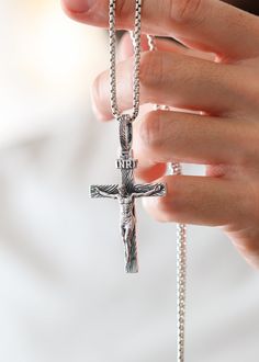 A Catholic Silver Cross is the perfect way to show your faith and devotion. This beautiful and intricate cross symbolizes the love and mercy of God. Crafted with exquisite attention to detail, it’s a stunning reminder of your faith that you can carry with you. Let it be a sign of your enduring faith. Sterling silverPendant: 65 x 35 mmBail size: 12.8 x 6.5 mmPlease note: pendant only; chain sold separatelyShown with: ROUND BOX SILVER CHAIN (2.6 MM) Processing time 1-3 business days Engraved White Gold Cross Necklace, Luxury Sterling Silver Cross Necklace, Luxury White Gold Cross Necklace As Gift, Luxury Silver Cross Necklace, Spiritual White Gold Crucifix Cross Necklace, White Gold Crucifix Necklace Spiritual Style, Spiritual White Gold Crucifix Necklace, White Gold Crucifix Necklace, Engraved Cross Jewelry For Blessing