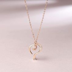 Love is Never Ending: Classic heart pendant design, the necklace is the best choice to show your love and gift for women and girls. Set a diamond in the middle of the heart pendant to look more luxurious. Wearing it, you will be the focus on any occasions. Materials: 14K Solid Rose Gold and Diamond. Pendant Size: 16*13MM. Chain Length: 16"+2" Extender for Adjusting. Weight: Total 1.68g. Gold And Diamond Pendant, Dainty Pendant Necklace, Dainty Pendant, Necklace Online, Pendant Design, Rose Gold Necklace, Rose Gold Diamonds, Diamond Heart, Diamond Pendant