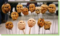 some kind of food that looks like faces are hanging on a rack with other items