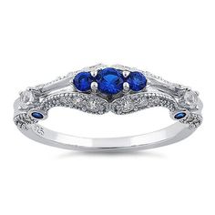 Top of ring height: 6mm

Band width: 1.9mm

Shank width: 1.6mm


 



Stone material: blue & clear cubic zirconia



Center stone size: 3.2mm



Stone size: round cut



Center stone carat weight: .11 ct



Total number of CZ stones: 29



Stone setting: prong setting



 



Metal: 925 sterling silver



Plating: rhodium plated 



Finish: high polish Sapphire Cubic Zirconia Cluster Ring For Promise, Sapphire Cluster Ring With Center Stone In Cubic Zirconia, Elegant Blue Cubic Zirconia Stackable Rings, Sapphire-colored Crystal Ring With Prong Setting And Cubic Zirconia, Sapphire Crystal Ring With Cubic Zirconia In Prong Setting, Cubic Zirconia Sapphire Ring For Promise, Sapphire Cubic Zirconia Promise Ring With Center Stone, Sapphire Cluster Ring With Cubic Zirconia In Round Cut, Blue Cubic Zirconia Stackable Rings For Anniversary