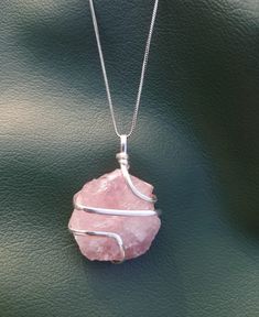 The Rose Quartz Crystal Necklace is renowned for being a symbol of unconditional love and affection. Its energy is said to make relationships stronger, so that you don't need to take advice from others. This crystal is associated with Venus, the goddess of love, and has been used for centuries to heal, meditate, improve relationships, and protect. It is especially helpful in dealing with emotional trauma. With its nurturing power, you can create the relationship you desire. To use the Rose Quart All Our Hidden Gifts, Wire Wrapped Crystal Necklace, Crystal Necklace Healing, Wrapped Crystal Necklace, Wire Wrapped Crystal Pendant, Love And Healing, Wire Wrapped Crystal, Rose Quartz Jewelry, Wrapped Crystal