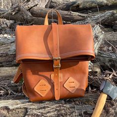 "This beautiful, all leather backpack is made using a soft & pliable full-grain leather for the body. All of the straps and handles are made using full grain bridle leather. This all-purpose backpack is the perfect size for any hiking / backpacking trip or even school! Seams are double stitched and all rivets are hand-peened solid brass for superior strength. The bag includes two lashing tabs on the front at the bottom for attaching additional bags or equipment. Buckles are brass with roller Leather Backpack Shoulder Bag For Outdoor, Leather Backpack With Leather Patch For Everyday Carry, Leather Satchel Backpack For Outdoor, Waxed Finish Vegetable Tanned Leather Backpack, Outdoor Satchel Backpack With Leather Lining, Leather Backpack With Waxed Finish For Outdoor Activities, Leather Backpack With Waxed Finish For Outdoor, Everyday Leather Backpack With Leather Patch, Leather Backpack With Leather Lining For Adventure