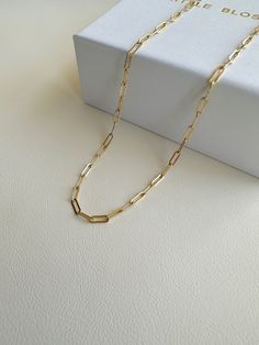 "Dainty Gold Filled paper clip chain necklace.    --------------------------------------------- >>  Length: 40cm or 45cm >>  Material: 14k gold filled   >>  Chain Dimensions: 2.5mm x 6.5mm >>  Hypoallergenic,nickel free,sensitive skin friendly&tarnish resistant. ------------------What is gold filled ------------------ Most of our findings and wires are made with 14k gold filled.\"Gold-filled\" is a USA industry standard that legally requires 5% pure gold by weight. It is a solid layer of gold bonded to another metal through heat and pressure. It does not wear off or turn colours over time, and if taken care of properly it can last a lifetime.Gold-filled jewellery is a cheaper, yet the best alternative to solid gold. It's hypoallergenic and water-safe." Minimalist Paperclip Chain Necklace As Gift, Minimalist Paperclip Chain Necklace For Gift, Minimalist Paperclip Chain Necklace Gift, Paperclip Chain Necklace As A Gift, Gold Chain Paperclip Necklace For Gifts, Gold Paperclip Chain Necklace With Box Chain, Paperclip Chain Necklace With Adjustable Chain As Gift, Classic Paperclip Chain Necklace As Gift, Gift Paperclip Chain Necklace