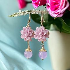 ⭐️ Discover the irresistible charm of our Pink Dahlia Earrings that are made with pink jade! Handcrafted with hypoallergenic materials, these lightweight floral-shaped dangles are not only adorable but also perfect for sensitive ears.  ⭐️ The pink bead is made by jade that we optimize the color to pink.  ⭐️ Their vibrant pink hue adds a pop of color to any outfit, making them ideal for a variety of occasions, including date nights, weddings, parties, and everyday wear.  ⭐️ Elevate your style effortlessly with these cute and versatile earrings. Shop now and experience the joy of wearing these delightful accessories! 🎁 These would be great pieces to keep for yourself or gift to your special ones! They are perfect for get well soon gift, birthday gift, bridesmaid gift, secret Santa gift, and Pink Dangle Flower Earrings For Gift, Pink Dangle Flower Earrings Gift, Pink Elegant Flower Earrings For Valentine's Day, Elegant Pink Flower Earrings For Valentine's Day, Pink Flower-shaped Earrings For Valentine's Day, Nickel-free Pink Earrings For Birthday, Pink Flower Earrings Gift For Her, Pink Drop Earrings For Birthday, Pink Dangle Flower Earrings For Mother's Day