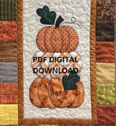 a quilted wall hanging with pumpkins and the words pdp digital download on it