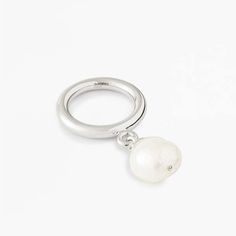 Nova ring in sterling silver with freshwater pearl.    - band width: 3.5mm  - pearl diameter: 12mm  - fit: true to size  - nickel free rhodium plating  - base metal is recycled sterling silver  - handcrafted in high polish  - every pearl is unique in shape and color  - myw05ss217pl Modern White Gold Sterling Silver Pearl Ring, White Gold Sterling Silver Open Pearl Ring, Sterling Silver Pearl Drop Ring For Promise, Sterling Silver Pearl Drop Ring For Promise Occasions, Minimalist Silver Pearl Rings, Sterling Silver White Gold Pearl Ring With Pearl Drop, Sterling Silver Pearl Drop Ring In White Gold, Silver Open Ring With Pearl Drop, Elegant Sterling Silver Pearl Drop Ring