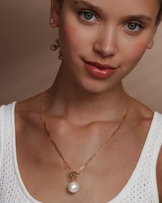 Mother Nature, upping your style game since forever. A classic chain never goes out of style, but add a perfect pearl and a toggle detail and you’ve got a necklace you’ll never want to take off. DETAILS: Pendant Necklace Length: 22" Front Toggle Closure SKU: N6226 MATERIALS: 18k Gold Plated Over Brass Shell Pearl Timeless Round Chain Necklace For Gift, Melinda Maria Jewelry, Brass Shell, Melinda Maria, Pearl Pendant Necklace, Gold Pendant Necklace, Pearl Pendant, Necklace Length, A Necklace