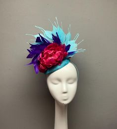 This bold fascinator is perfect for horses races, bridal showers, tea parties, hat luncheons or any other special event.  ► Want it now? Click the "Buy it now" button. ► Love it and want to buy later? Click on the button that says "♥ Favorite" ► Special request/contact me? Click the "Ask a question" link on the right. ► All Sales Are Final. Please contact me before purchasing if you have any questions. ► My shop policies: https://www.etsy.com/shop/tinselandtonic/policy?ref=shopinfo_policies_leftnav Thanks for visiting Tinsel and Tonic!! Please visit my other shops - wrapmeinfur.etsy.com for all your faux fur scarf needs  and abitoftinsel.etsy.com for one of a kind statement jewelry Evening Headpiece With Pinched Crown For Kentucky Derby, Evening Pinched Crown Headpiece For Kentucky Derby, Elegant Hair Accessories For Races And Carnival, Elegant Hair Accessories For Carnival Races, Elegant Hats With Matching Headband For Kentucky Derby, Headband For Garden Party At Royal Ascot, Summer Formal Costume Headband, Structured Crown Costume Hat For Royal Ascot, Royal Ascot Headband Fascinator