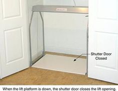 an open closet door showing the bottom shelf and bottom shelf with a sign on it