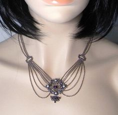 A wonderful fine 835 European silver necklace circa 1920 set with cultured pearls and Natural Amethyst Cabochons. This very feminine necklace is designed to drape beautifully down the decolletage. The pendant at the front including the drop measures approximately 1 9/16" and is 1 9/16" side to side (40mm x 39mm). It is set with four cultured pearls each approximately 3.5mm in diameter. The top amethyst cabochon measures 7.5mm by 5.5mm approximately and the one at the bottom measures approximatel Antique Pendant Jewelry For Opera, Victorian Jewelry With Historical Design For Evening, Victorian Pendant Jewelry For Opera, Victorian Style Jeweled Necklace For Formal Occasions, Victorian Round Necklace With Jewels, Victorian Pearl Pendant Jewelry For Formal Occasion, Victorian Pearl Necklace For Formal Occasions, Victorian Hallmarked Jewelry For Opera, Victorian Style Formal Pearl Necklace