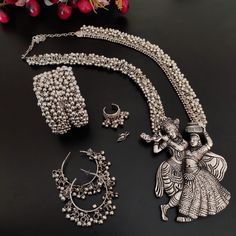 Artfully designed, the amount of detailing on this handmade oxidized Radha Krishna jewelry set is absolutely astonishing. Every time you look at your NECKLACE, you will see something different that you will love . This German silver jewelry set is perfect for daily wear, party wear, casual wear, office wear, ethnic wear, festive wear and ideal for traditional functions, weddings, and, receptions. This package includes a set of big necklace, earrings,, a pair of bangles, a ghungroo ring and nosep Rajasthani Silver Jewellery, Silver Indian Jewelry Set, Oxodice Jewellery, Silver Jewellery Indian Antique, Antique Silver Jewelry Indian, Navratri Ideas, China Country, Trendy Silver Jewelry, Oxidized Jewellery