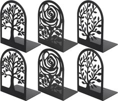 four black metal bookends with trees and flowers on each one, set of 4