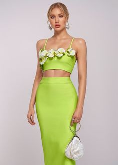 Introducing THEODORA Two-Piece Bandage Set. Made with bandage material, this set combines a delicate floral crop top with a figure-hugging maxi skirt in a vibrant neon green. Perfect for a night out, this set will accentuate your curves and make you stand out from the crowd. Elevate your style with THEODORA. Fabric: Slight Stretch Material: Polyester, Spandex Summer Party Crop Top Set, Summer Party Sets With Crop Top, Spring Two-piece Cropped Dress, Green Two-piece Party Set, Spring Party Green Sets, Green Two-piece Dress For Spring, Cropped Dress For Spring Party, Spring Party Two-piece Crop Top, Cropped Dresses For Night Out In Spring