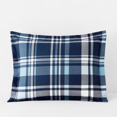 a blue plaid pillow on a white background