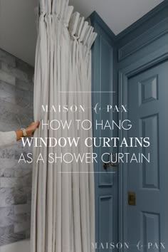 a person is opening the curtain to show how to hang window curtains as a shower curtain