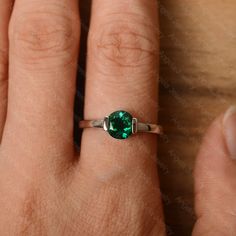 It is a lab emerald ring. The main stone is 7 mm*7 mm round cut.weight about 1.30 carats. The basic metal is sterling silver and plated with rhodium/14k white gold/14k rose gold/14k yellow gold You can also go to my shop Home for more elegant rings: https://www.etsy.com/shop/godjewelry?ref=hdr_shop_menu Customization is always welcome and please feel free to contact with me if you have any design ideas! Emerald Bezel Setting Birthstone Ring For May, Emerald Birthstone Ring With Bezel Setting For May, Anniversary White Gold Emerald Ring With Bezel Setting, Emerald Bezel Setting Promise Ring For May Birthstone, Emerald Birthstone Ring With Bezel Setting, Emerald Ring With Bezel Setting For Anniversary, May Birthstone, Emerald Solitaire Promise Ring, Minimalist Emerald Birthstone Ring With Bezel Setting, Solitaire Round Emerald Ring For Promise