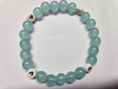 Sky blue, glass heart braclet. Blue Heart-shaped Bracelets For Gifts, Blue Heart-shaped Gift Bracelets, Elegant Blue Bracelets With Heart Charm, Elegant Blue Bracelet With Heart Charm, Blue Heart Bracelet With Round Beads, Casual Blue Jewelry With Heart Beads, Trendy Blue Glass Jewelry, Blue Bracelets With Heart Charm And Round Beads, Casual Blue Heart-shaped Bracelets