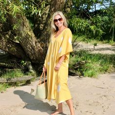 This yellow Kaftan is made of  breathable cotton fabric and  is a perfect summer dress for your next beach vacation.  The fabric is carefully handwoven by skilled artisans from North India known for their exceptional weaving abilities. Handwoven fabrics are known for their slight irregularities and minor variations, which showcase the unique human touch and cultural heritage behind each piece.  Wear it as a breezy and effortless daytime dress for a casual yet chic look. 100% Cotton. Hand wash cold separately | Line dry | Don't tumble dry | Can be dry cleaned too Yellow Kaftan, Cotton Kaftan Dress, Daytime Dress, Statement Outfit, Human Touch, Cotton Kaftan, North India, Handwoven Fabric, Yellow Ties